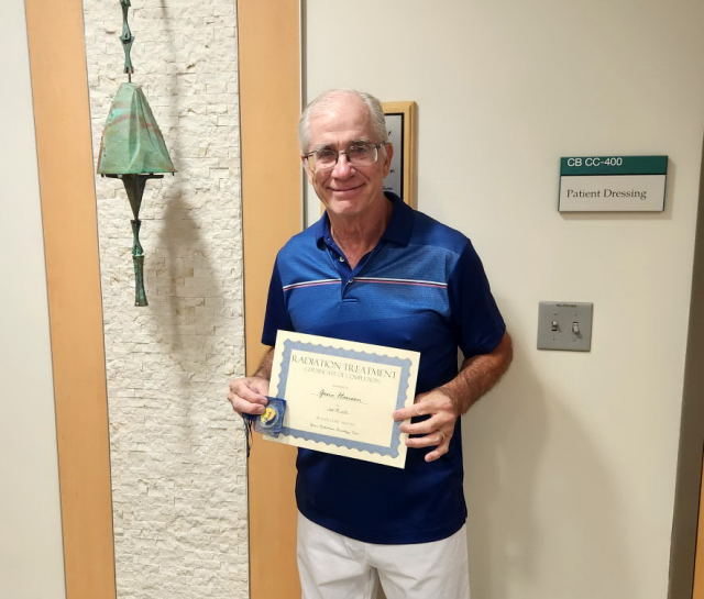 Gene with certificate next to the Arcosanti Bell